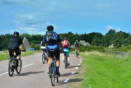 group of cyclists going on the road in the countrysideのeditorial素材