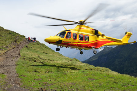 yellow rescue  helicopter in Alps, Val Di Fassa, Italyのeditorial素材