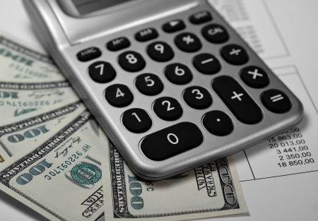 Calculator, money and paper with numbers, Shallow depth of field の写真素材