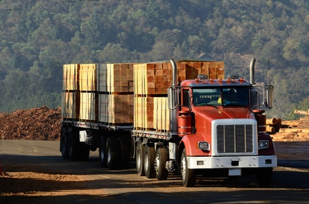 A truck loaded with lumber leaves a sawmill in Oregonの写真素材