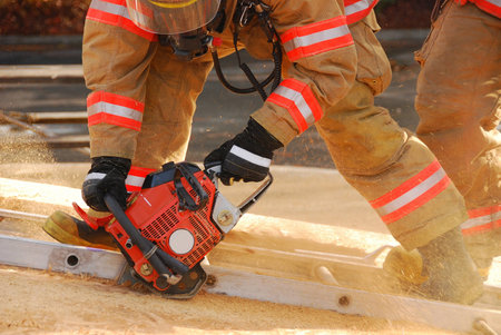 Vertical ventilation drill behind fire station using vent saw 