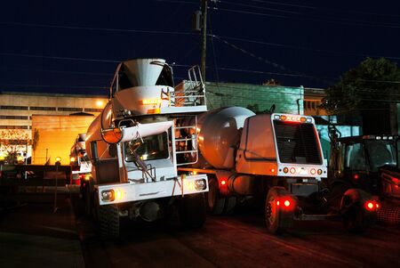 One Concrete Truck Coming, One Going, Nightime concrete pour of bottom floor of new Public Service Station in Downtown Roseburg ORの写真素材