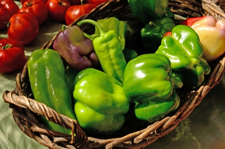  A vendor sales organic green peppersi at a local farmers market in Oregonの写真素材