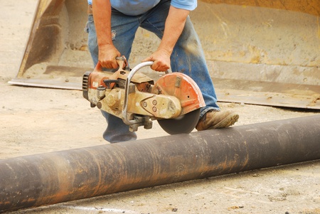 Cutting a 8-inch water pipe to extend  the water main into a new business center in Roseburg Oregonの写真素材