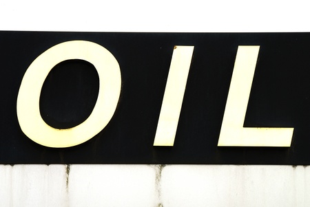 Oil letterning on a sign outside a service station buildingの写真素材