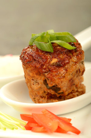 A meatball in an asian setting table top food shotの写真素材
