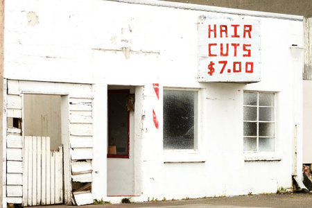 An old now closed barber shop in the Empire district, Coos Bay Oregon at har cuts seven dollars