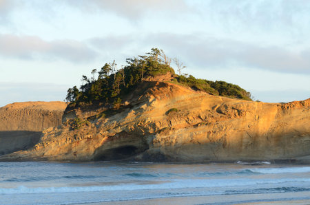 Unique sand spit  Bob Straub Park   in the sunrise morning light at Pacific City Oregon with mild...