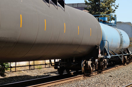 Train passes through an industrial section of a large northwest american city carrying hazardous...