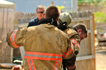 Roseburg, Oregon - July 31, 2013: Fire fighters respond to a structure fire in a residence that caused major interior damage.  No body was injured in the Roseburg, Oregon incident on July 13, 2013のeditorial素材