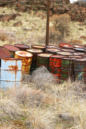 Old abandoned chemical fuel barrels in the high desert of central Washington state の写真素材