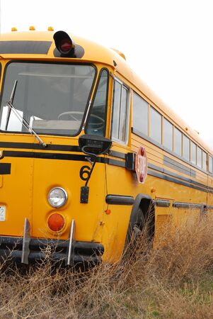 Old school bus in a storage yard in Wenantchee Washingtonの写真素材