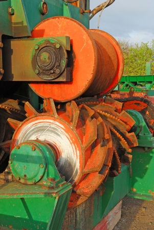 Old lumber sawmill processing equipment in a local forest products mill bone yard の写真素材