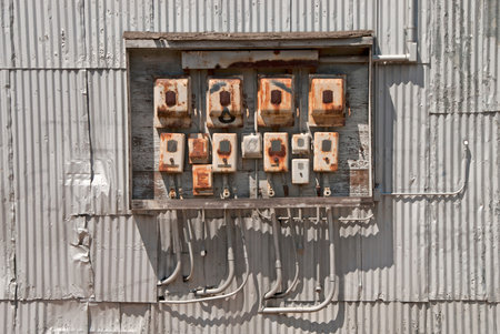 Large bank of vintage electrical switches at a petroleum bulk plant in the industrial area of Portland Oregonの写真素材