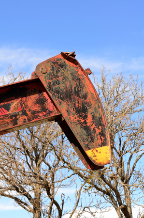 pumpjack, (nodding donkey,  horsehead pump, rocking horse, beam pump, dinosaur, sucker rod pump, grasshopper pump, Big Texan, thirsty bird, or jack pump) is the overground drive for a reciprocating piston pump in an oil well. in eastern Texasの写真素材