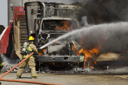Fire fighters respond to a semi truck and silage fire at a dairy farm in Gustine, CA, on June 18, 2014のeditorial素材