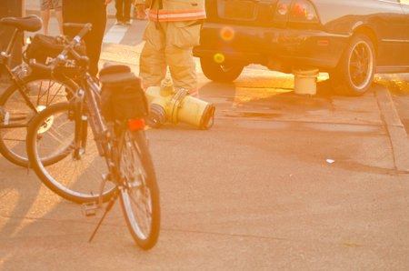 Roseburg Oregon Police and Fire department at the scene of a single car accident that knocked over a fire hydrant, July 12, 2014のeditorial素材