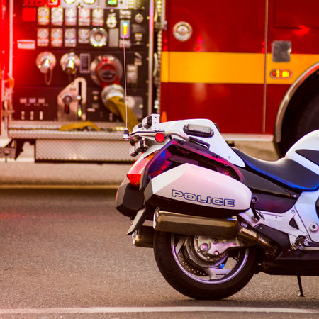 Roseburg Oregon Police and Fire department at the scene of a single car accident that knocked over a fire hydrant, July 12, 2014のeditorial素材