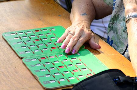 Playing BINGO at a local county fair fundraiserの写真素材