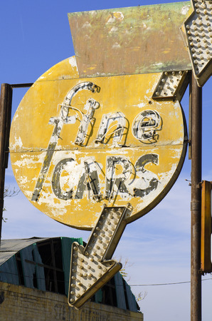 Vintage american electric bulb highway road sign with an an arrowの写真素材