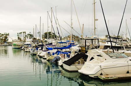 Pleasure boats sit in Dana Harbor California on a winter morning