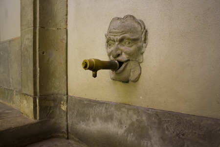 Face on a old Water Fountain in Barcelonaの写真素材
