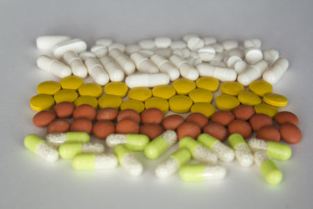 Assortment of pills divided by colorの写真素材