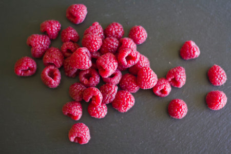 Fresh raspberry on black background