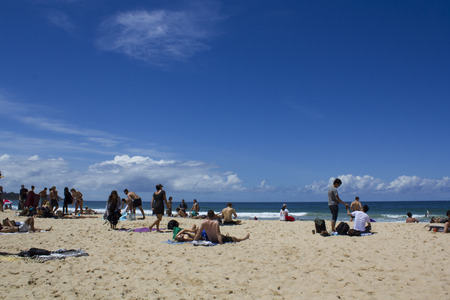 People sunbathe at beachのeditorial素材
