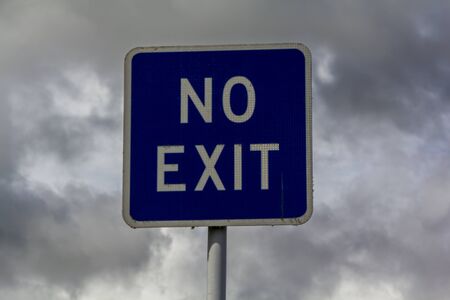 No exit sign against stormy cloudsの写真素材