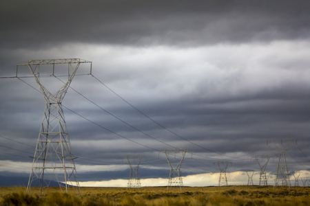 Power Pylons on Desert landscapeの写真素材
