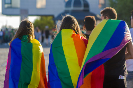 Group of people with gay rainbow flag at an LGBT gay pride