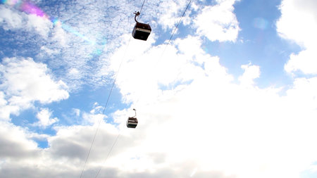 Cable car crossing the skyの写真素材