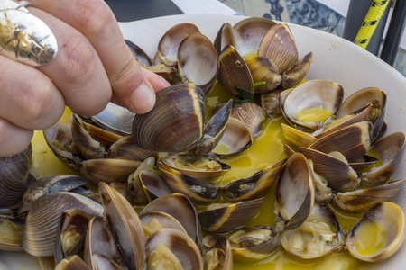 Woman eating seafood.の写真素材