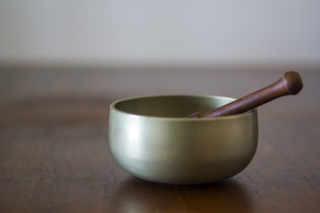 Tibetan Singing Bowl on wooden tableの写真素材