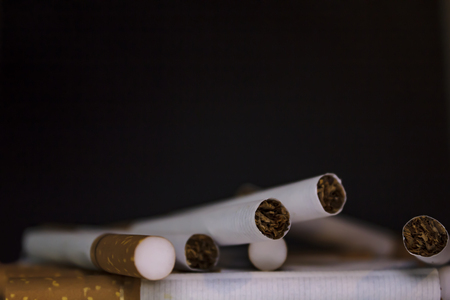 Cigarettes on black backgroundの写真素材