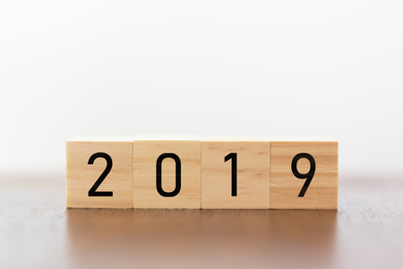 New year 2019 on wooden cubes on table with copy space for textの写真素材