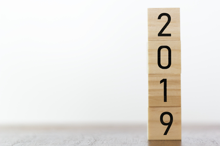 New year 2019 on wooden cubes on table with copy space for textの写真素材