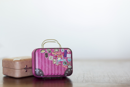Travel Suitcases on wooden table with copy space: Travel conceptの写真素材