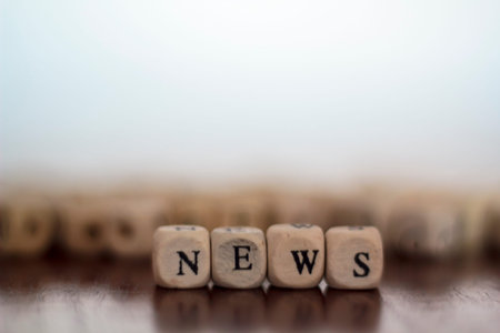 News written on wooden cubes. With copy space