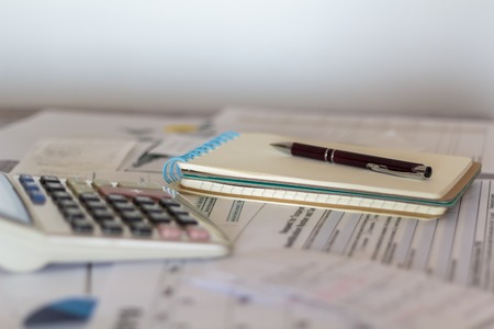 Desk with accounting paperworkの写真素材