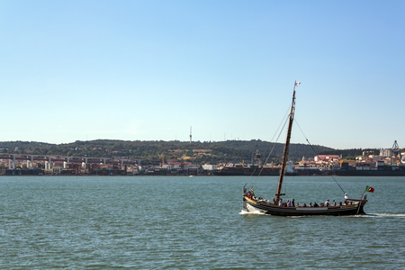 Traditional portuguese boat on touristic tour at river tagusの写真素材