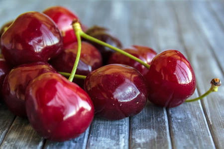 Fresh cherries on wooden vintage backgroundの写真素材