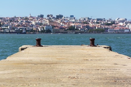 Pier with city on the backgroundの写真素材