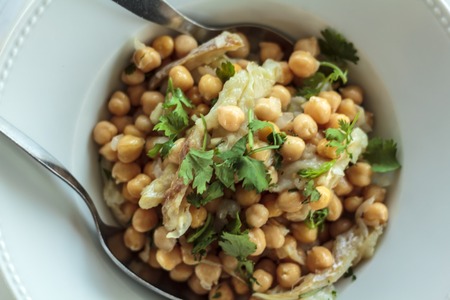 Top view of Grain salad with cod and coriander. Typical portuguese cuisineの写真素材
