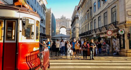 LISBON, PORTUGAL - CIRCA September, 2019: Lisbon downtown and vintage red tram passingのeditorial素材