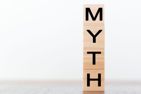 Myth word on wooden cubes with copy space