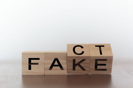 Fact and fake on words on wooden cubesの写真素材