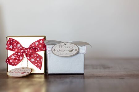 Two gifts on wooden table with copy spaceの写真素材