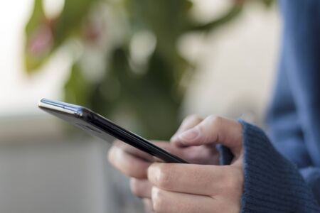 Woman hands using smartphoneの写真素材